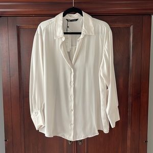 Zara white silky blouse with mother of pearl buttons. Long-sleeved.